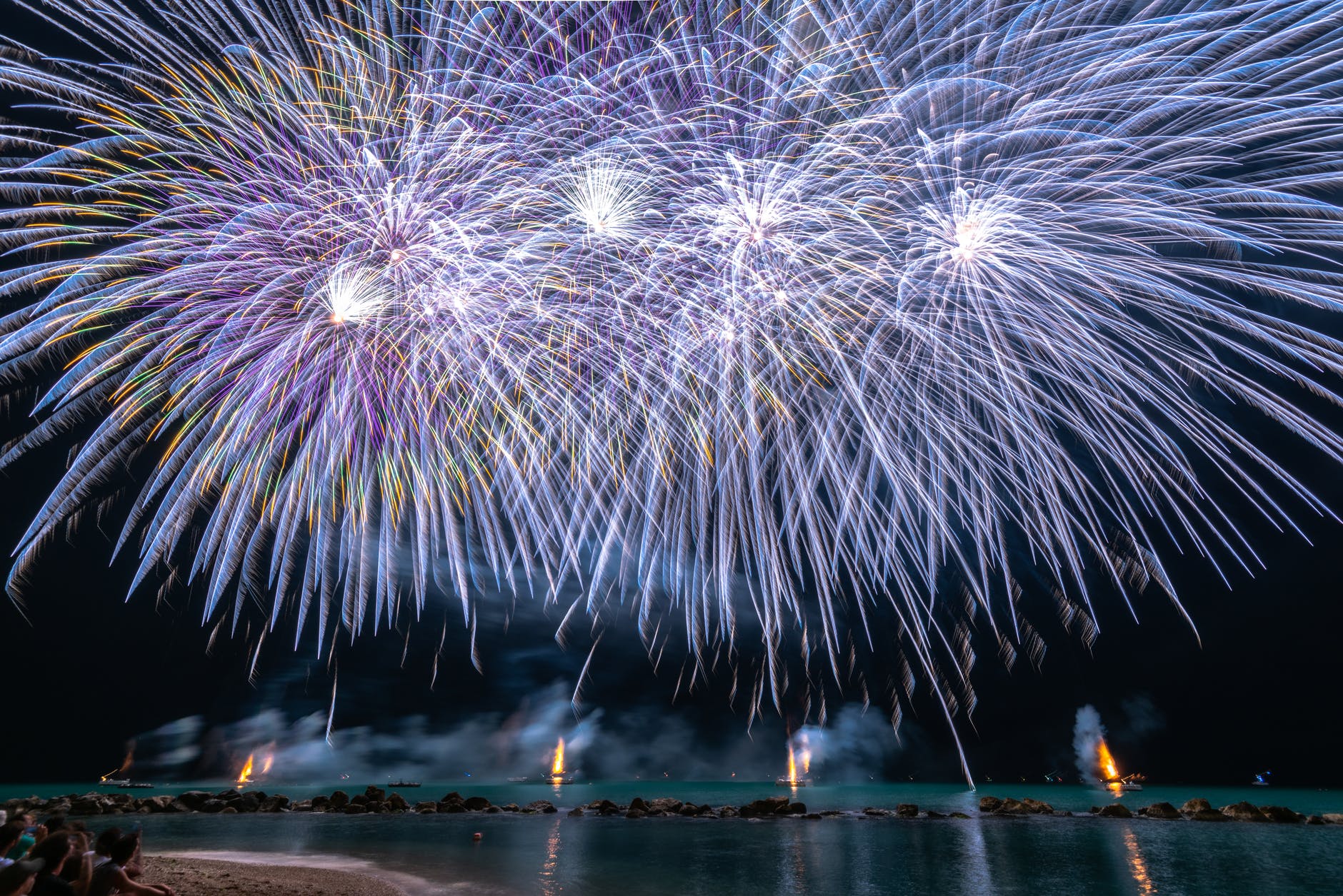 photo of fireworks near sea